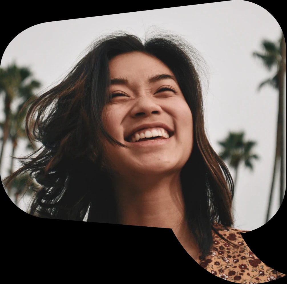 Picture of a woman in speech bubble smiling